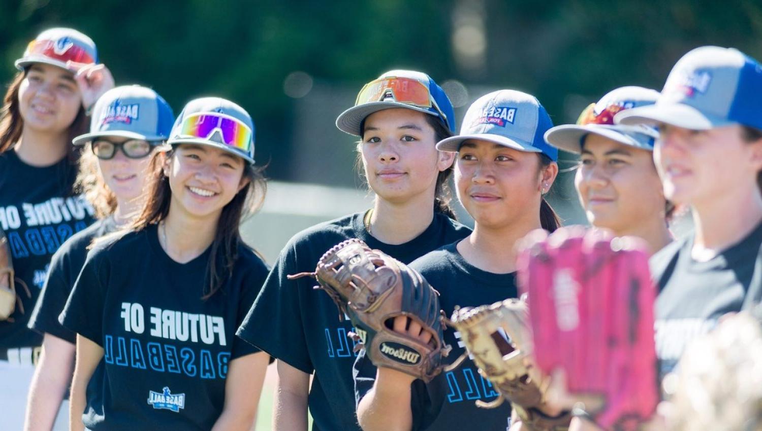 A group of female baseball players