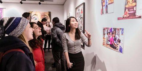 A group of people looking at art